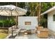 Outdoor fireplace with seating offers a cozy space for relaxation and outdoor gatherings in a lush backyard setting at 40 Dunnemann Ave, Charleston, SC 29403