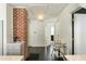 Hallway leads to a bedroom, revealing dark wood floors, brick accent wall at 40 Dunnemann Ave, Charleston, SC 29403