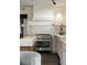 Modern kitchen features marble backsplash, a stainless steel range, and gray cabinetry at 40 Dunnemann Ave, Charleston, SC 29403
