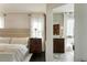Bright main bedroom featuring a bathroom doorway and classic bedside furnishings at 40 Dunnemann Ave, Charleston, SC 29403