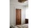 Bedroom featuring a door to a walk-in closet, dark wood floors and neutral decor at 40 Dunnemann Ave, Charleston, SC 29403