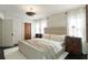 Cozy main bedroom with white walls, bedside tables, and a brass ceiling fixture at 40 Dunnemann Ave, Charleston, SC 29403