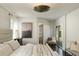 Bright main bedroom with modern furnishings, a striking art piece, and a private outdoor patio at 40 Dunnemann Ave, Charleston, SC 29403