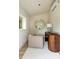 Bright office with a modern desk, comfortable chair, large window, and a stylish round mirror at 40 Dunnemann Ave, Charleston, SC 29403