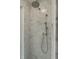 The shower is adorned with pristine white marble tiling, complete with a rainfall showerhead and handheld sprayer at 40 Dunnemann Ave, Charleston, SC 29403