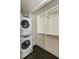 Closet showing washer, dryer, storage shelves, and chrome hanging rods at 40 Dunnemann Ave, Charleston, SC 29403