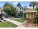 Charming backyard featuring a pool, pool house, patio, and lush landscaping for a relaxing outdoor space at 44 Savage St, Charleston, SC 29401