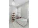 Bright bathroom featuring a modern soaking tub, shelving unit, and shuttered windows at 44 Savage St, Charleston, SC 29401