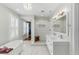 Bright bathroom featuring a soaking tub, double sink vanity, and a walk-in shower with a wooden stool at 44 Savage St, Charleston, SC 29401