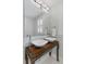 Bathroom features a modern vanity with dual sinks, a large mirror, and stylish fixtures at 44 Savage St, Charleston, SC 29401