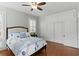 Charming bedroom with a queen bed, hardwood floors, bright windows, and a spacious closet to keep your belongings tidy at 44 Savage St, Charleston, SC 29401