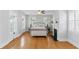 Airy bedroom with a queen bed, hardwood floors, bright windows, and decorative fireplace to make the space warm at 44 Savage St, Charleston, SC 29401