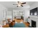 This bright bedroom features a fireplace and a peak into the sitting area with leather chairs at 44 Savage St, Charleston, SC 29401