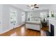 Cozy bedroom featuring a bed, hardwood floors, natural light, and a fireplace for a warm and relaxing atmosphere at 44 Savage St, Charleston, SC 29401