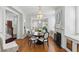 Elegant dining room featuring hardwood floors, a fireplace, and chandelier lighting at 44 Savage St, Charleston, SC 29401