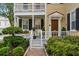 Inviting front porch with rocking chairs and manicured landscaping at 44 Savage St, Charleston, SC 29401