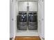 Well-lit laundry room with modern Maytag washer and dryer units and ample storage cabinets at 44 Savage St, Charleston, SC 29401