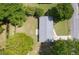 Aerial view of home with a new roof surrounded by lush trees and greenery at 4432 Logwood Drive, Ladson, SC 29456
