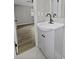 Bright bathroom features a modern vanity with matte black faucet and fixtures and a bedroom view at 4432 Logwood Drive, Ladson, SC 29456