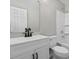 Bright bathroom features a white vanity, a shower-tub combo, and matte black hardware at 4432 Logwood Drive, Ladson, SC 29456