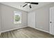 Bedroom featuring wood floors, closet, and a ceiling fan at 4432 Logwood Drive, Ladson, SC 29456