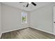 Bedroom with wood floors, a bright window, and light gray walls at 4432 Logwood Drive, Ladson, SC 29456