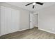 Bedroom with wood floors, white closet doors, and gray walls at 4432 Logwood Drive, Ladson, SC 29456