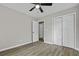 This bedroom is complete with a ceiling fan, closet, and an open doorway at 4432 Logwood Drive, Ladson, SC 29456