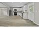 Bright kitchen with white cabinets, stainless steel appliances, and wood-look flooring at 4432 Logwood Drive, Ladson, SC 29456