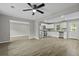 Renovated kitchen featuring stainless steel appliances, white cabinets, and open layout to living area at 4432 Logwood Drive, Ladson, SC 29456