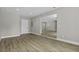 Living room showing wood flooring and views into other rooms at 4432 Logwood Drive, Ladson, SC 29456