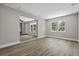 Open-concept living room with light gray walls and wood-look flooring at 4432 Logwood Drive, Ladson, SC 29456