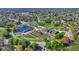 Aerial view of a baseball park, playground, and community center surrounded by lush green trees and park space at 4577 Summey St, North Charleston, SC 29405