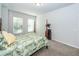 Bright bedroom featuring a four-poster bed, neutral walls, and plush carpeting at 4577 Summey St, North Charleston, SC 29405
