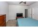 Comfortable bedroom with a wooden dresser, TV stand, and blue bedding at 4577 Summey St, North Charleston, SC 29405