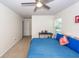 Bedroom with a ceiling fan, carpet, and a bed with blue bedding and decorative pillows at 4577 Summey St, North Charleston, SC 29405