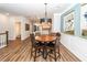 Stylish dining area features a round table, modern lighting, and an open view into the contemporary kitchen at 4577 Summey St, North Charleston, SC 29405