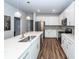 Modern kitchen featuring white cabinetry, stainless steel appliances, and a large island with pendant lighting at 4577 Summey St, North Charleston, SC 29405