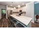 Modern kitchen featuring a large kitchen island with seating, stainless steel appliances, and pendant lights at 4577 Summey St, North Charleston, SC 29405