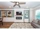 Open-concept living space with a modern fireplace, comfortable seating, and stylish decor throughout at 4577 Summey St, North Charleston, SC 29405