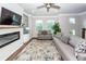 Bright living room with a modern fireplace, neutral color palette, and comfortable seating arrangement at 4577 Summey St, North Charleston, SC 29405