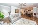 Spacious living room with neutral tones, modern seating, and an open floor plan leading to other areas at 4577 Summey St, North Charleston, SC 29405