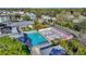 Overhead view of a pool with lounge chairs and a building with umbrellas, in a landscaped community setting at 4577 Summey St, North Charleston, SC 29405