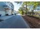 Street view featuring sidewalks and fencing, showcasing well-maintained landscaping in a residential neighborhood at 4577 Summey St, North Charleston, SC 29405