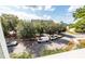 Tree-lined street with parked vehicles and buildings visible in the background at 4577 Summey St, North Charleston, SC 29405