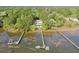 Beautiful waterfront home with a private dock and swimming pool, surrounded by lush greenery at 478 Commonwealth Rd, Mount Pleasant, SC 29466