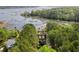 Charming waterfront home with lush greenery, featuring a private boat dock extending into the waterway at 478 Commonwealth Rd, Mount Pleasant, SC 29466