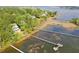 Waterfront home surrounded by lush greenery, and a private boat dock extending into the waterway at 478 Commonwealth Rd, Mount Pleasant, SC 29466