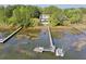 Beautiful waterfront home with a private dock and swimming pool, surrounded by lush greenery at 478 Commonwealth Rd, Mount Pleasant, SC 29466
