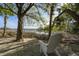 Relaxing backyard retreat with a view of the waterway and a comfortable Adirondack chair at 478 Commonwealth Rd, Mount Pleasant, SC 29466